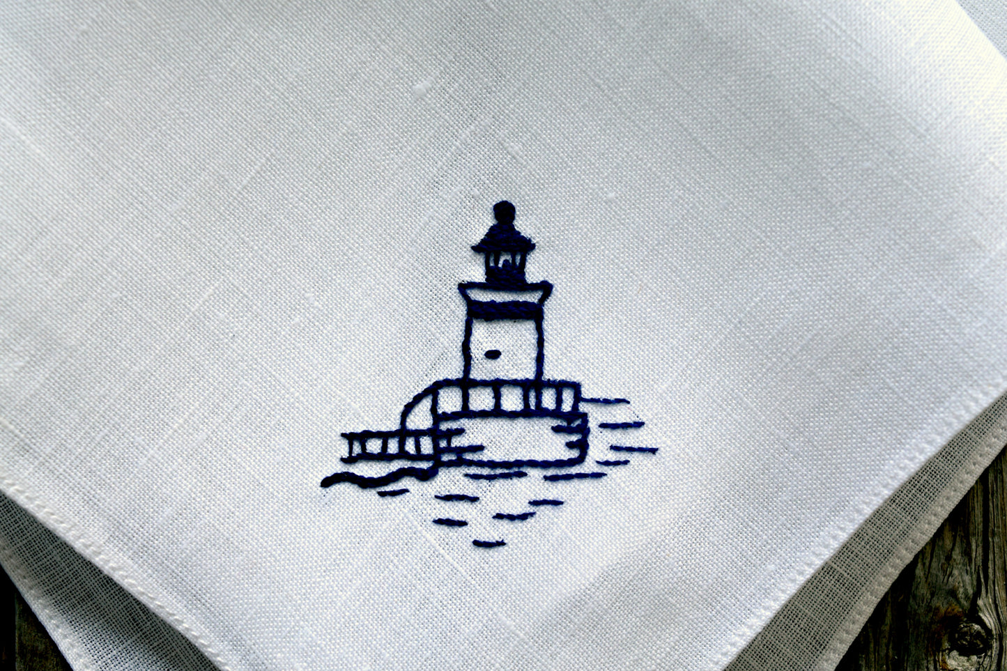 Closeup of Bug Light Lighthouse hand embroidered on pocket square