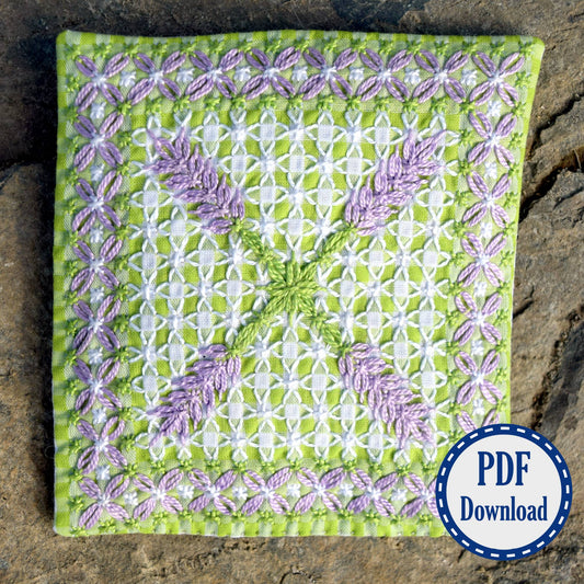 Purple green and white square with embroidered flowers and border in chickenscratch. PDF download sticker.