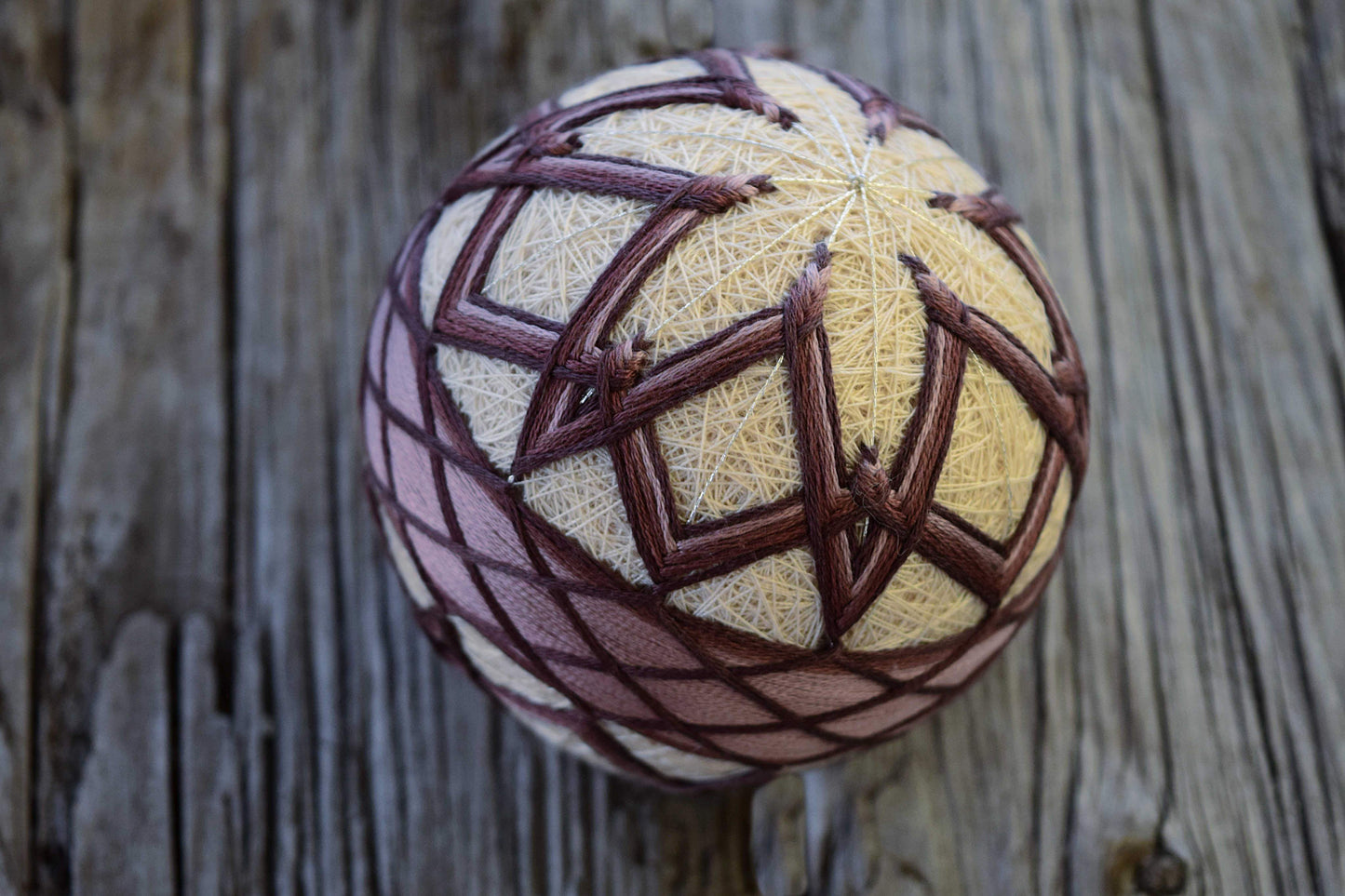 Temari ball embroidered with interlaced flower design