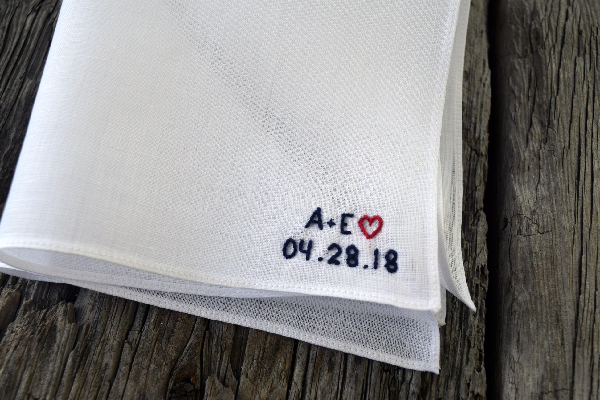 Close up of white Irish linen handkerchief showing minimalist block letter monogram