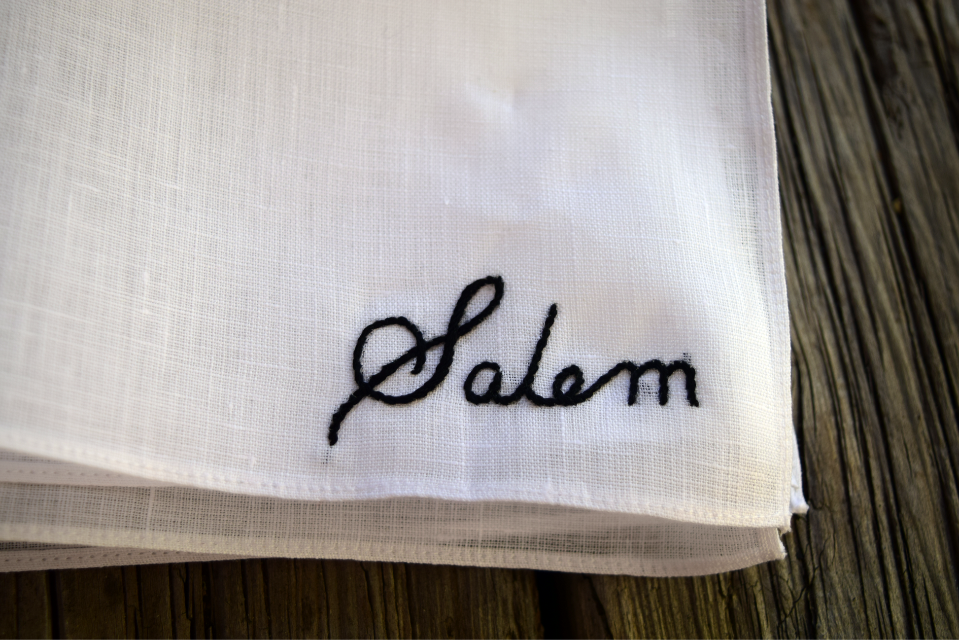 Close up of hand embroidered handkerchief, showing stitches