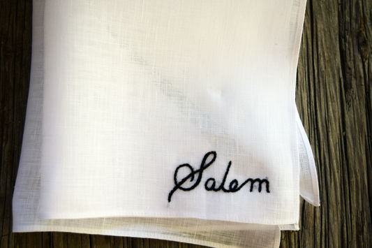 White Irish linen handkerchief with hand embroidered name, 'Salem'.