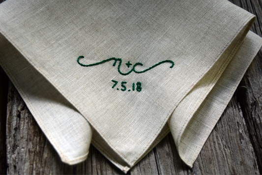 Soft beige handkerchief hand embroidered with green letters and date