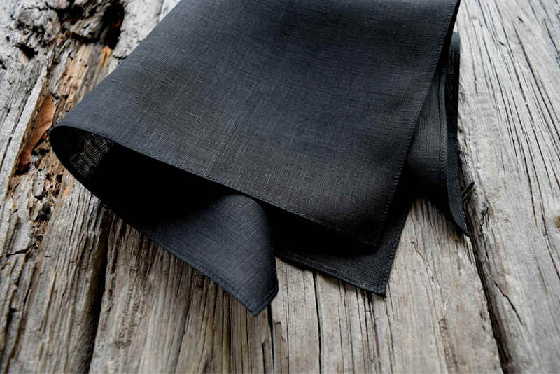 Closeup of black Irish linen pocket square showing hem detail
