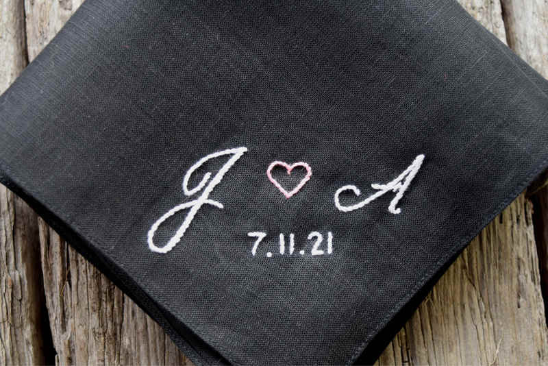 Closeup of monogrammed sweetheart handkerchief with wedding date