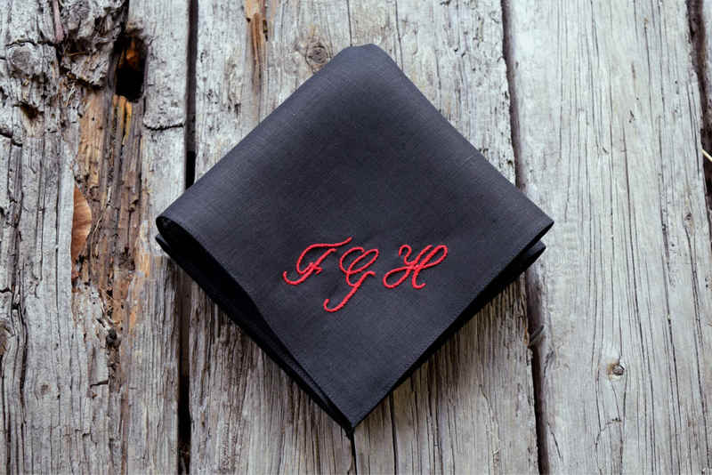 Black Irish linen handkerchief with three monogrammed letters FGH in red embroidery