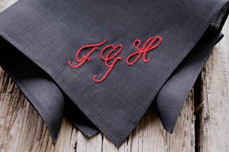 Hand embroidered black linen pocket square with FGH in red