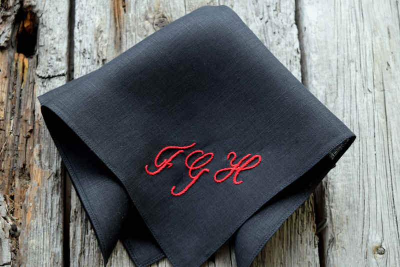 Black linen pocket square with red letters FGH in script