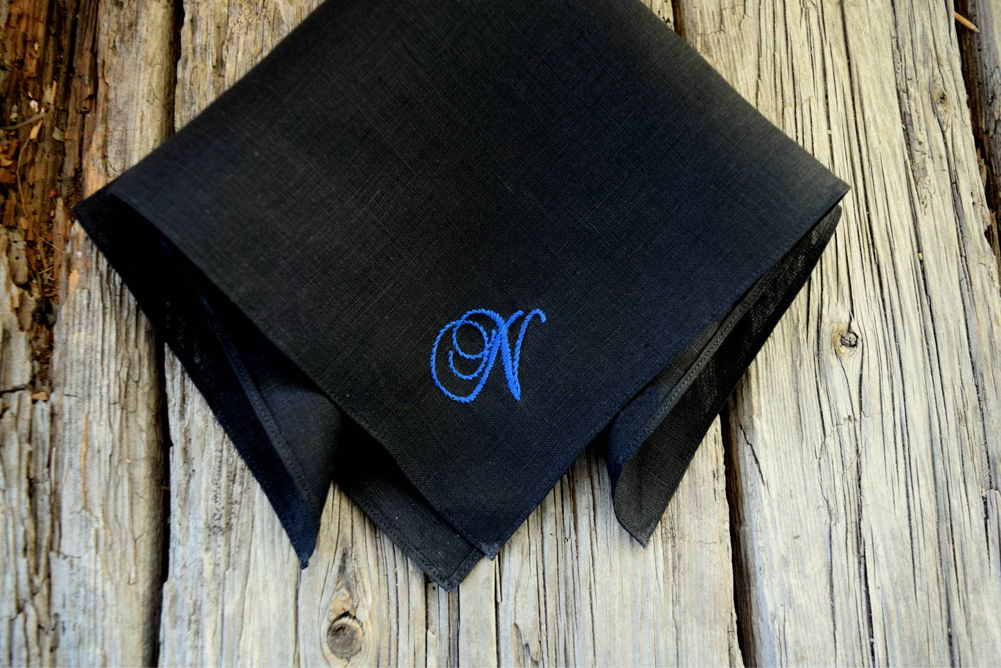 Black hanky monogrammed with one letter in blue cursive