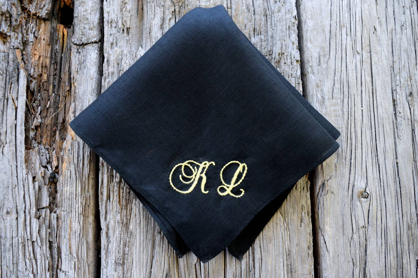 Black pocket square customized with yellow K L in antique script