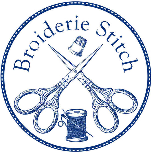 Circular seal in blue and white, depicting crossed embroidery scissors over a spool of thread, surmounted by a thimble and the name Broiderie Stitch