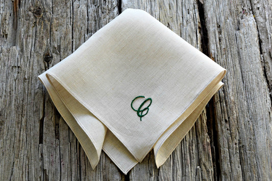 Oatmeal linen handkerchief hand embroidered with green letter C in cursive script