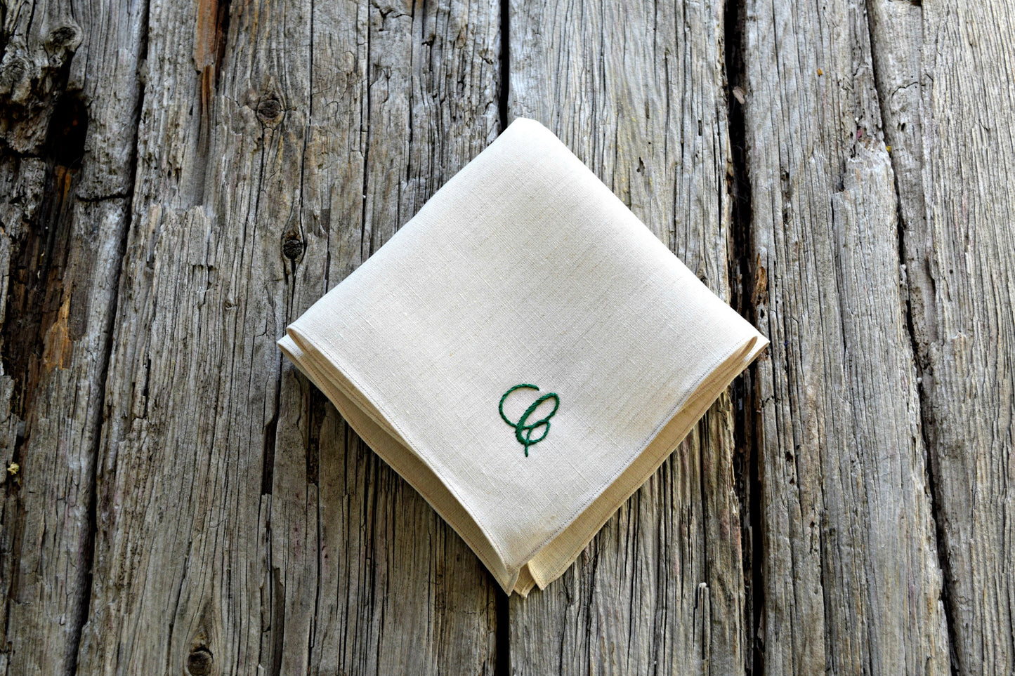 Irish linen handkerchief in oatmeal, hand embroidered with cursive green letter C
