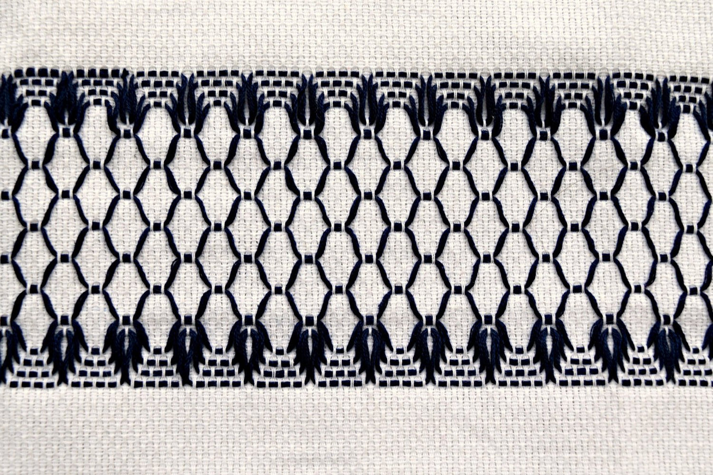 Closeup of swedish weaving huck towel showing pattern of diamonds