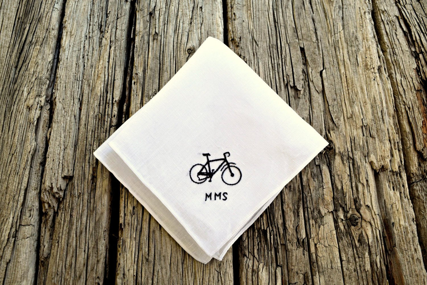 White Irish linen handkerchief embroidered with bike and initials in one corner