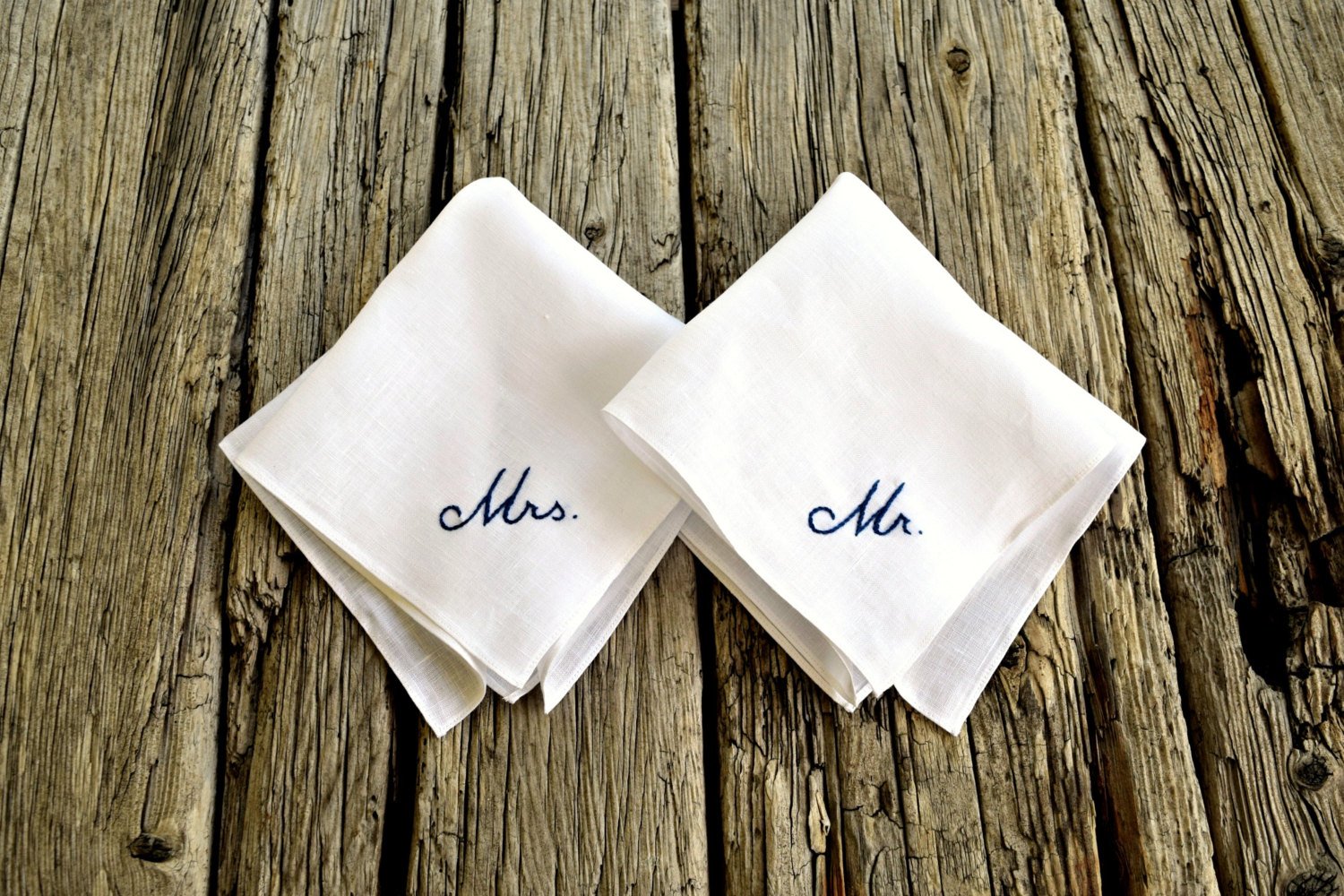 Two white linen handkerchiefs, one embroidered Mr. and one Mrs.