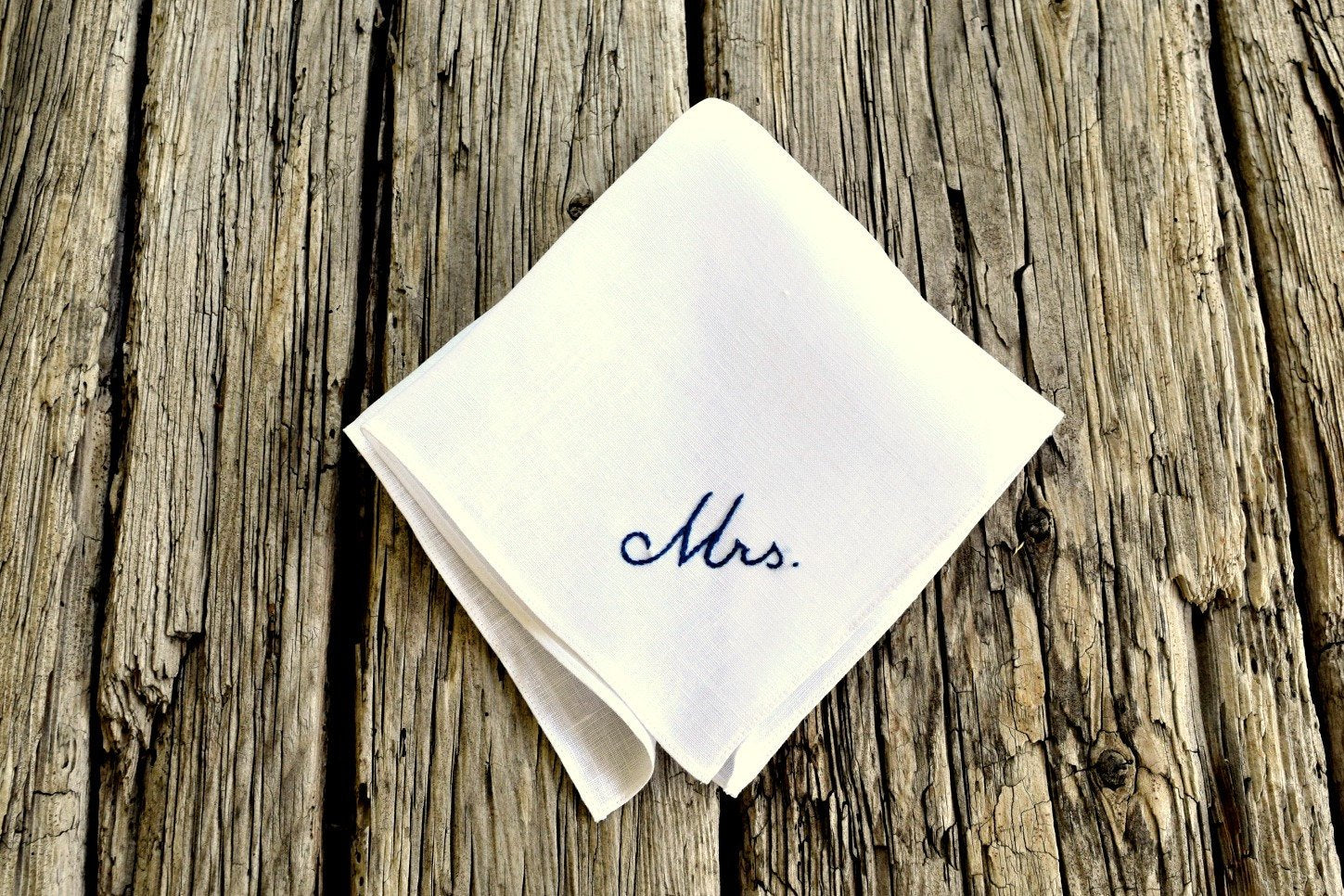 White Irish linen handkerchief hand embroidered with Mrs. in cursive script in black