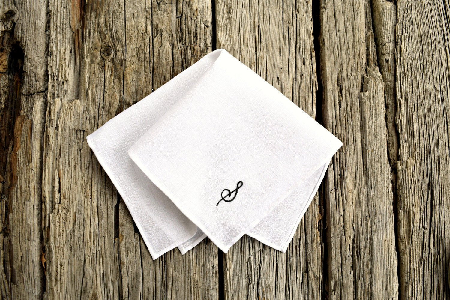 White Irish linen pocket square with hand rolled hem and hand embroidered initial in black