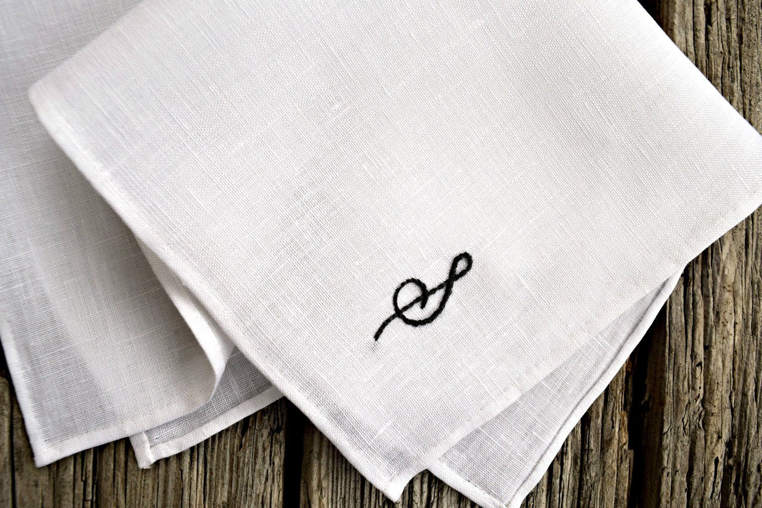 Closeup of hand stitched white Irish linen pocket square