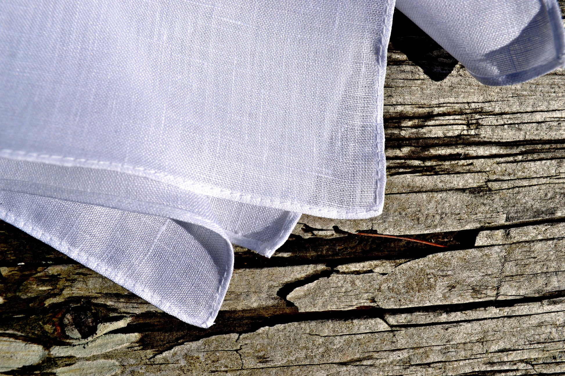 Closeup of white Irish linen pocket square showing hem detail