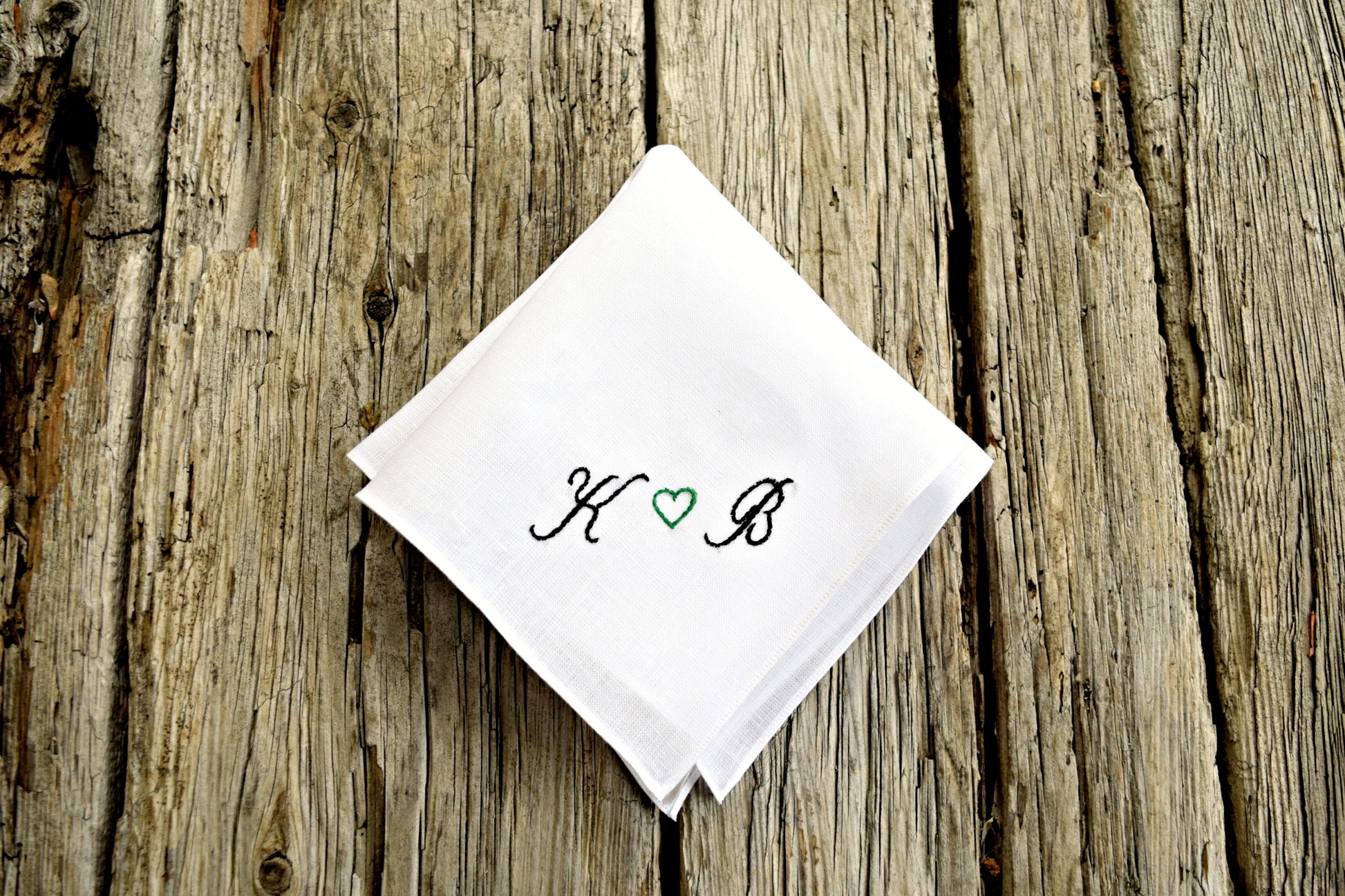 White Irish linen handkerchief embroidered ' K (heart) B ' in black and green
