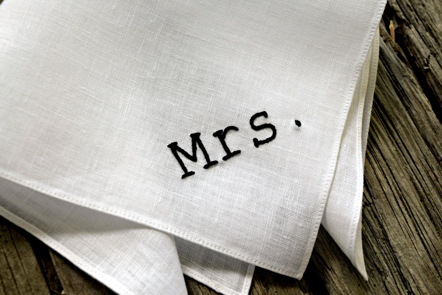 Close up of Mrs. handkerchief showing hand embroidered details