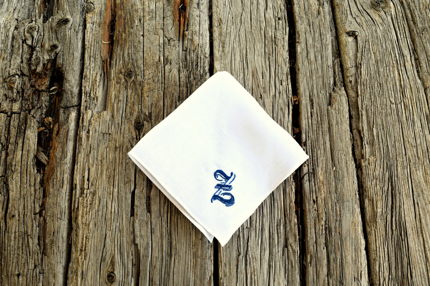 Irish linen handkerchief with ornate letter hand embroidered in blue